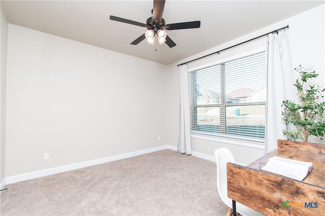 carpeted office with ceiling fan