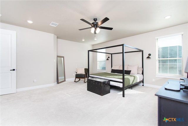 bedroom featuring light carpet and ceiling fan