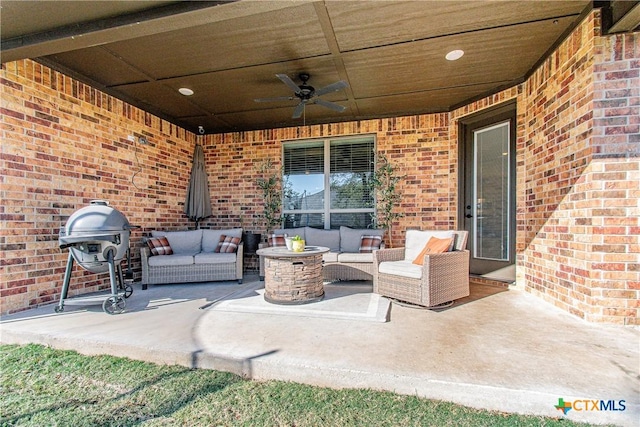 view of patio with ceiling fan, a grill, and an outdoor living space with a fire pit