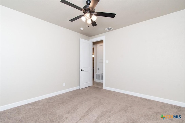 unfurnished room featuring light carpet and ceiling fan