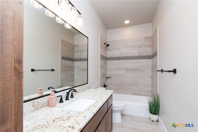 full bathroom with tile patterned floors, vanity, toilet, and tiled shower / bath