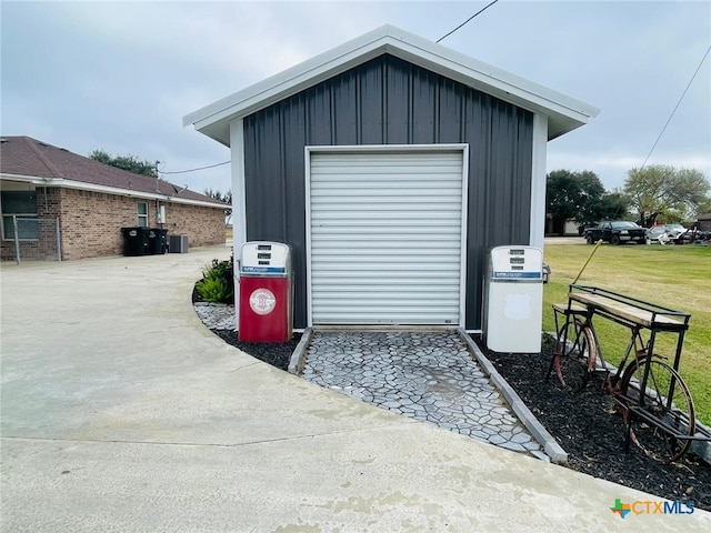 garage featuring a lawn