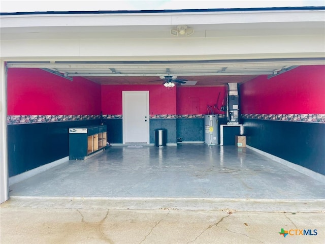 garage featuring ceiling fan and electric water heater