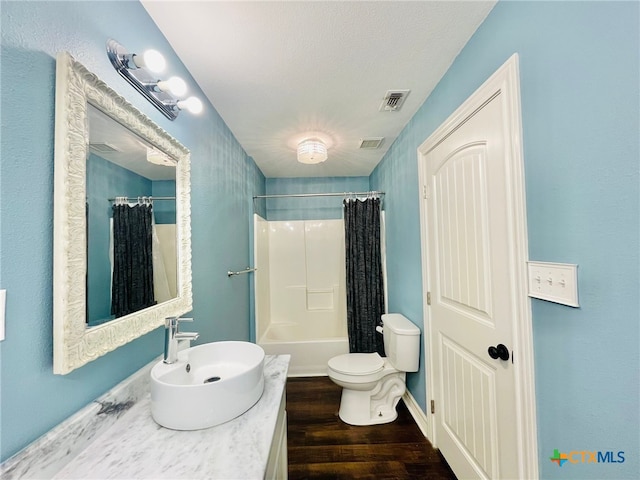 bathroom featuring hardwood / wood-style flooring, toilet, and sink