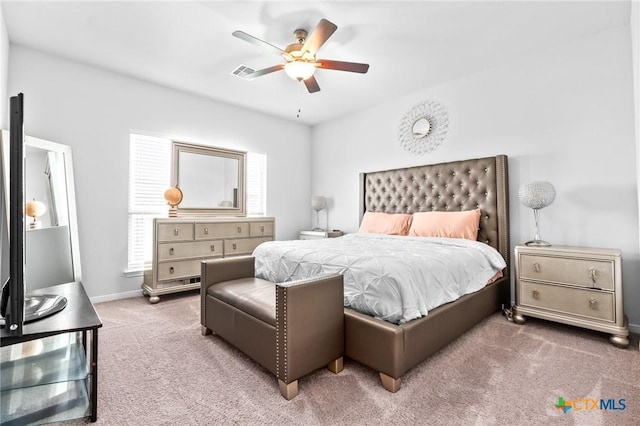 bedroom featuring visible vents, baseboards, ceiling fan, and carpet flooring