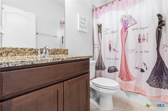 bathroom with tile patterned flooring, toilet, vanity, and shower / bathtub combination with curtain