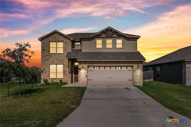 view of front of house featuring stone siding, a lawn, board and batten siding, and driveway