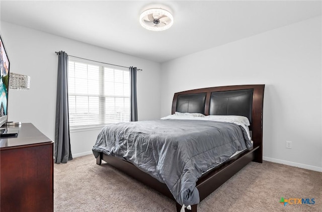 carpeted bedroom with baseboards