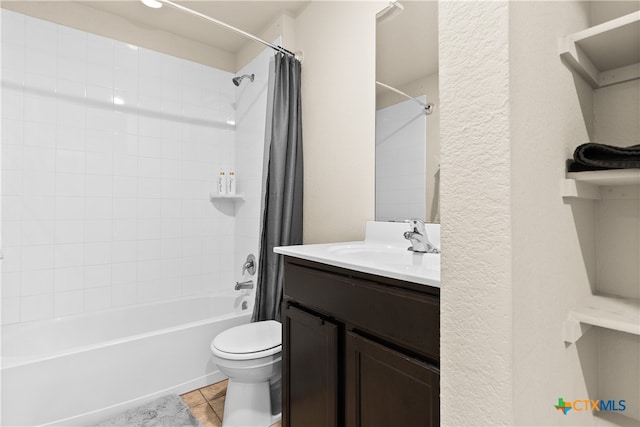 full bathroom with tile patterned flooring, vanity, toilet, and shower / tub combo