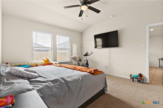 bedroom featuring ceiling fan, lofted ceiling, and carpet