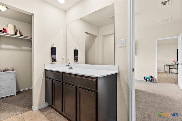 bathroom with vanity and tile patterned floors