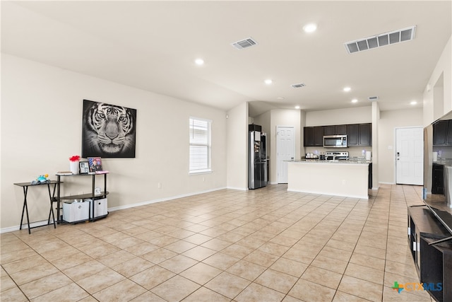 tiled living room featuring vaulted ceiling