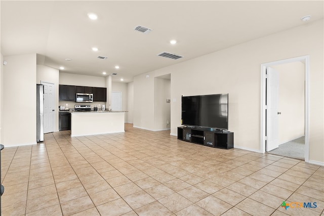 unfurnished living room with light tile patterned flooring