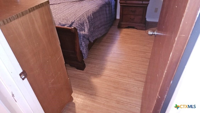 bedroom with light hardwood / wood-style flooring