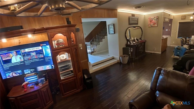 living room with dark wood-type flooring and crown molding