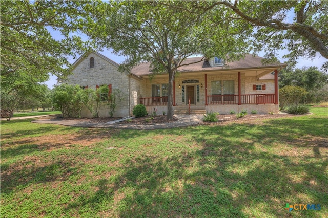 view of front of house with a porch and a front yard