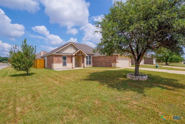 single story home featuring driveway, a garage, fence, and a front yard