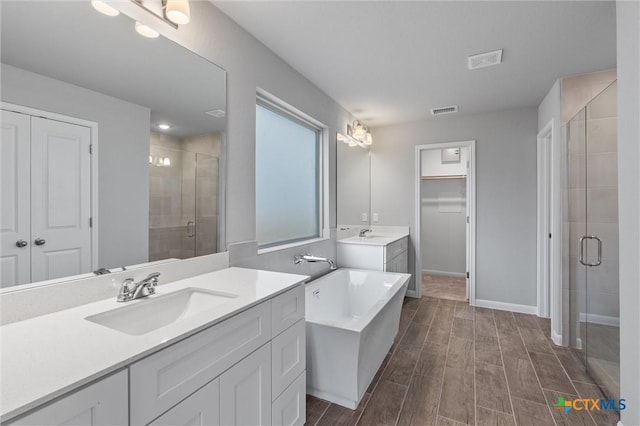 bathroom featuring vanity and walk in shower