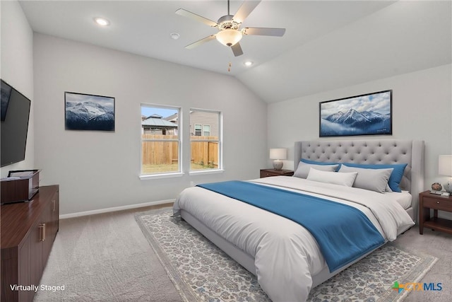 carpeted bedroom featuring lofted ceiling and ceiling fan