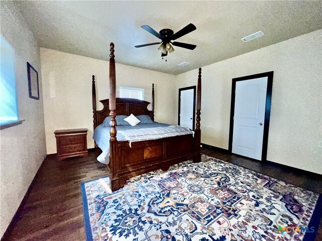 bedroom featuring dark wood-type flooring and ceiling fan