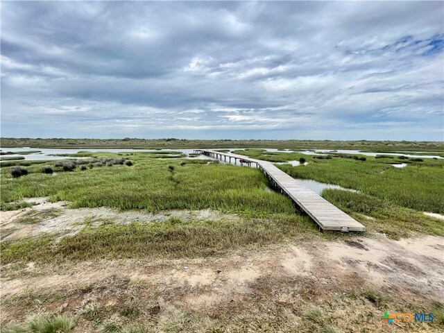 view of home's community with a water view and a rural view