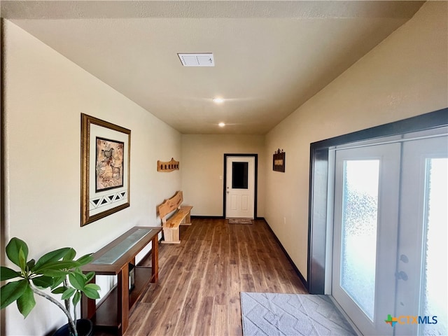 doorway featuring hardwood / wood-style floors and french doors