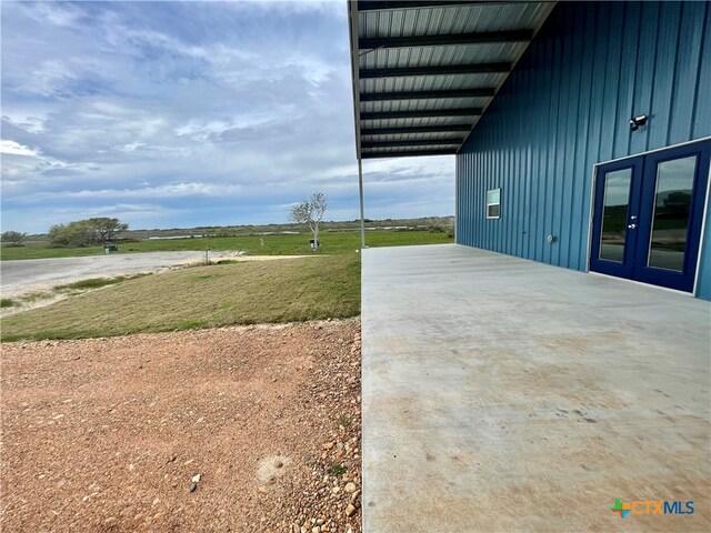 view of yard featuring french doors