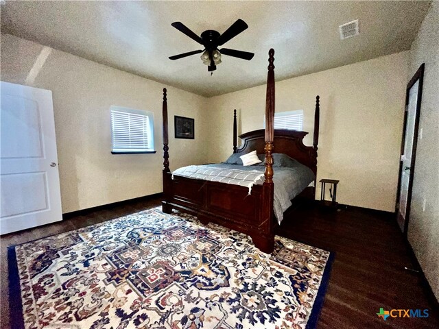 bedroom featuring ceiling fan and dark hardwood / wood-style floors