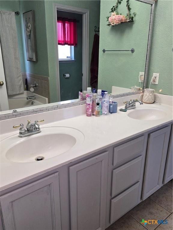 2301 Jake Dr, Copperas Cove, TX 76522 - full bath featuring double vanity, tile patterned floors, and a bath