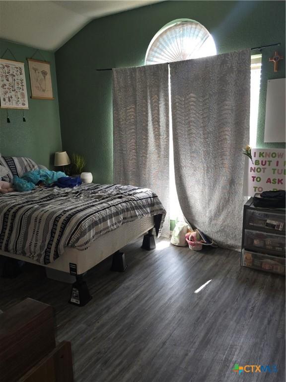 2301 Jake Dr, Copperas Cove, TX 76522 - bedroom featuring wood finished floors and lofted ceiling