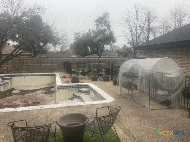 view of pool featuring an outbuilding