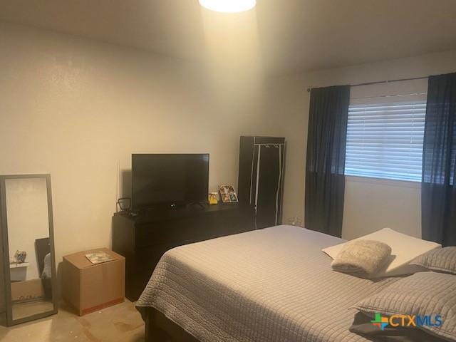 bedroom featuring light colored carpet