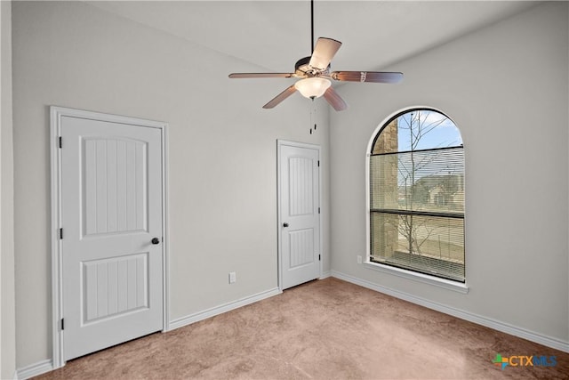 unfurnished bedroom featuring ceiling fan, carpet flooring, and baseboards