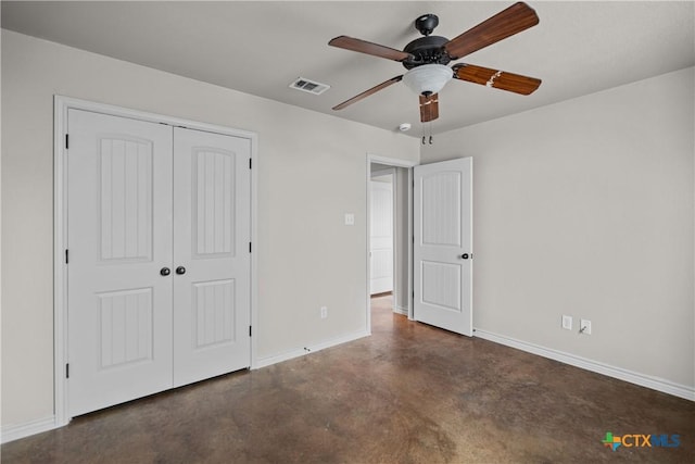 unfurnished bedroom featuring visible vents, baseboards, a ceiling fan, a closet, and finished concrete floors