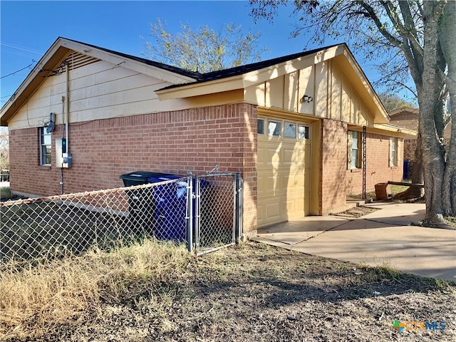 view of side of home with a garage