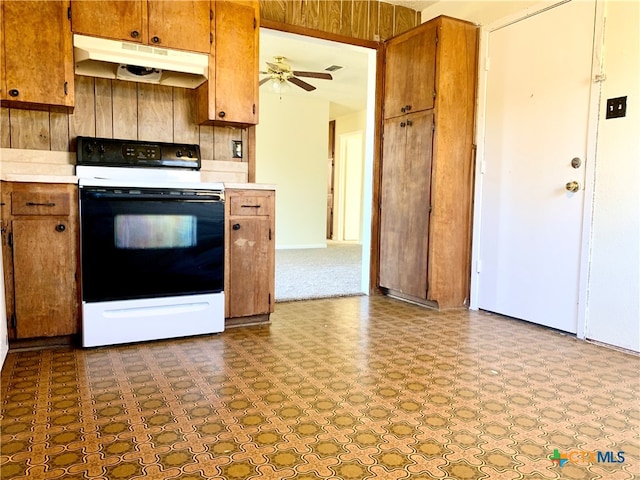 kitchen featuring white electric range oven and ceiling fan