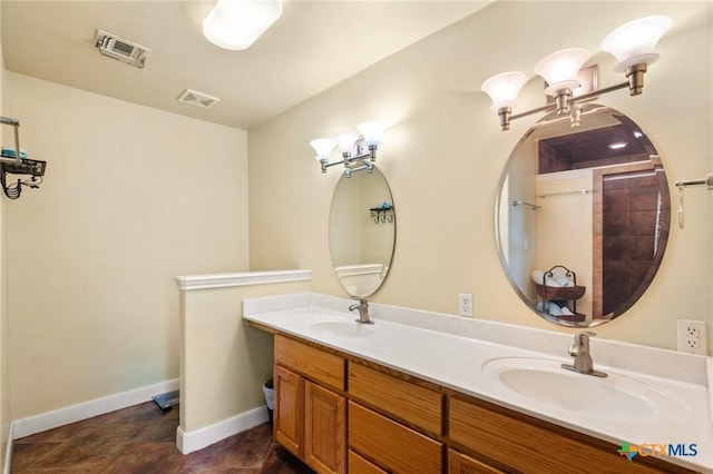 bathroom featuring walk in shower and vanity