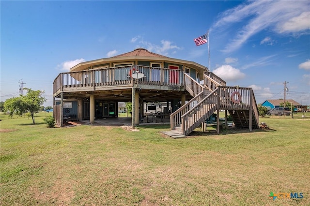 back of house with a wooden deck and a yard