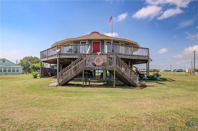 back of house with a yard and a deck