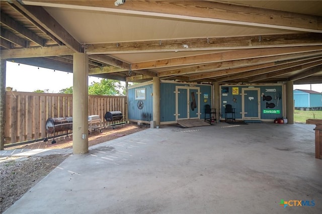 view of patio featuring an outbuilding