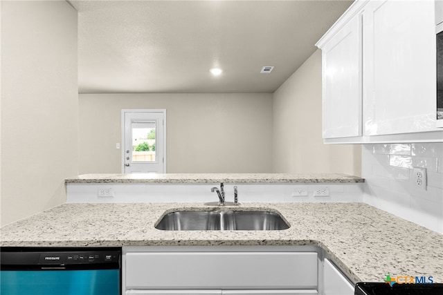 kitchen featuring dishwasher, white cabinetry, sink, and light stone countertops