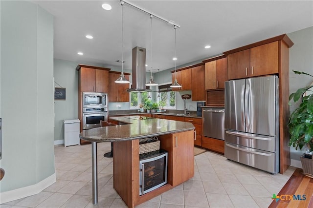 18917 Peckham Dr, Lago Vista, TX 78645 - kitchen with appliances with stainless steel finishes, island exhaust hood, brown cabinetry, a center island, and a kitchen bar