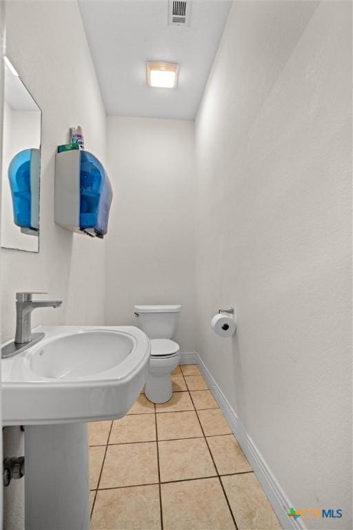 18917 Peckham Dr, Lago Vista, TX 78645 - bathroom with toilet and tile patterned floors