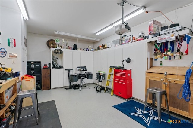 18917 Peckham Dr, Lago Vista, TX 78645 - garage with a garage door opener and a workshop area