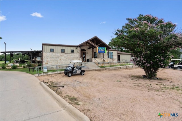 18917 Peckham Dr, Lago Vista, TX 78645 - view of front of property with stone siding and board and batten siding