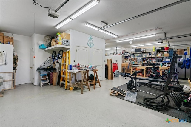 18917 Peckham Dr, Lago Vista, TX 78645 - garage featuring a workshop area and a garage door opener
