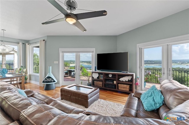 18917 Peckham Dr, Lago Vista, TX 78645 - living area with french doors, light wood finished floors, and a ceiling fan