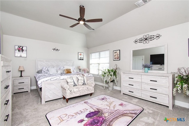 bedroom featuring light carpet, vaulted ceiling, and ceiling fan