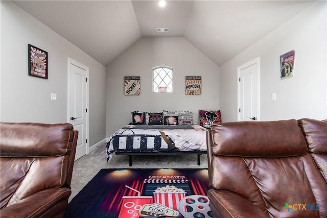 carpeted bedroom with lofted ceiling