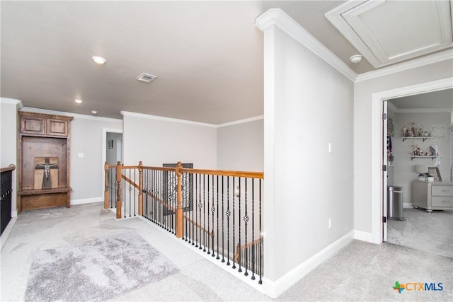 hall featuring light carpet and ornamental molding